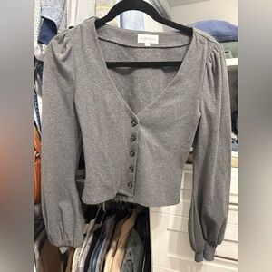 Revolve Button Front Top